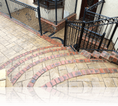 Ashlar Slate path and steps in Biscuit with Mahogany